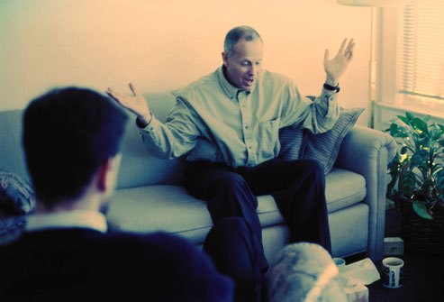 getty_rf_photo_of_man_in_therapy_session_gesturing